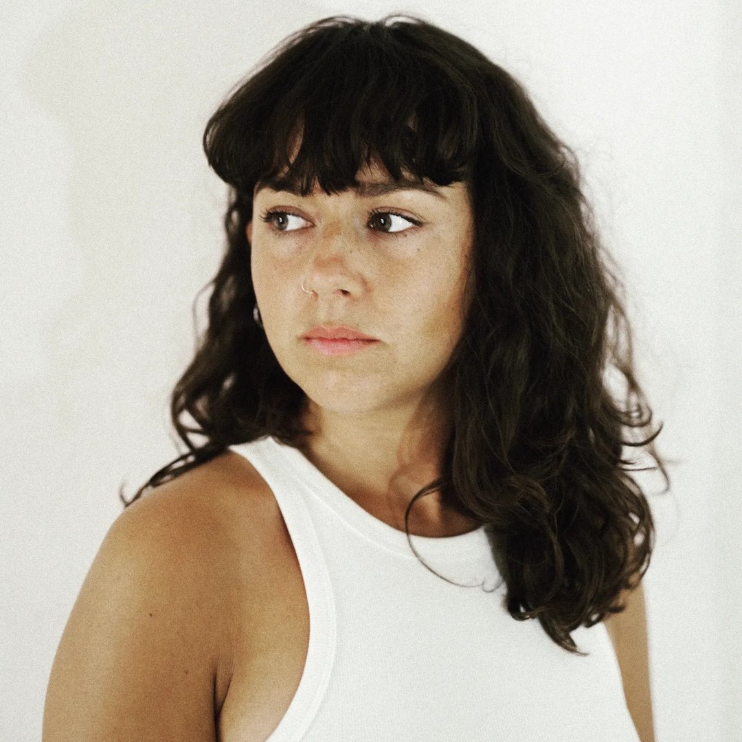 Barber 1 young man with beard smiling and wearing a  brown shirt